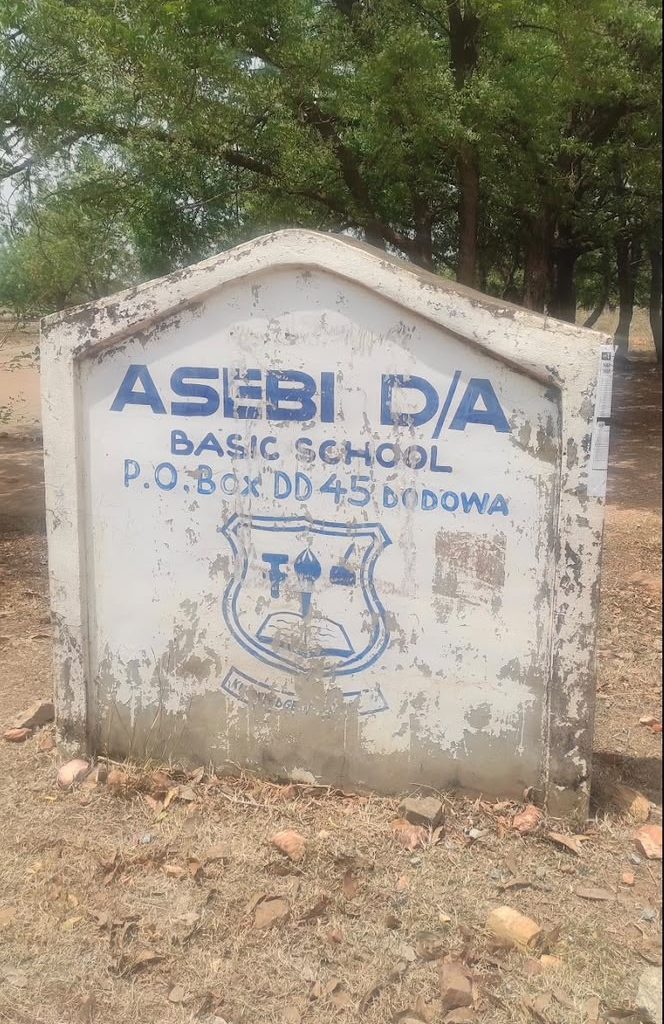 Exterior view of a school building and surrounding grounds in Ghana.